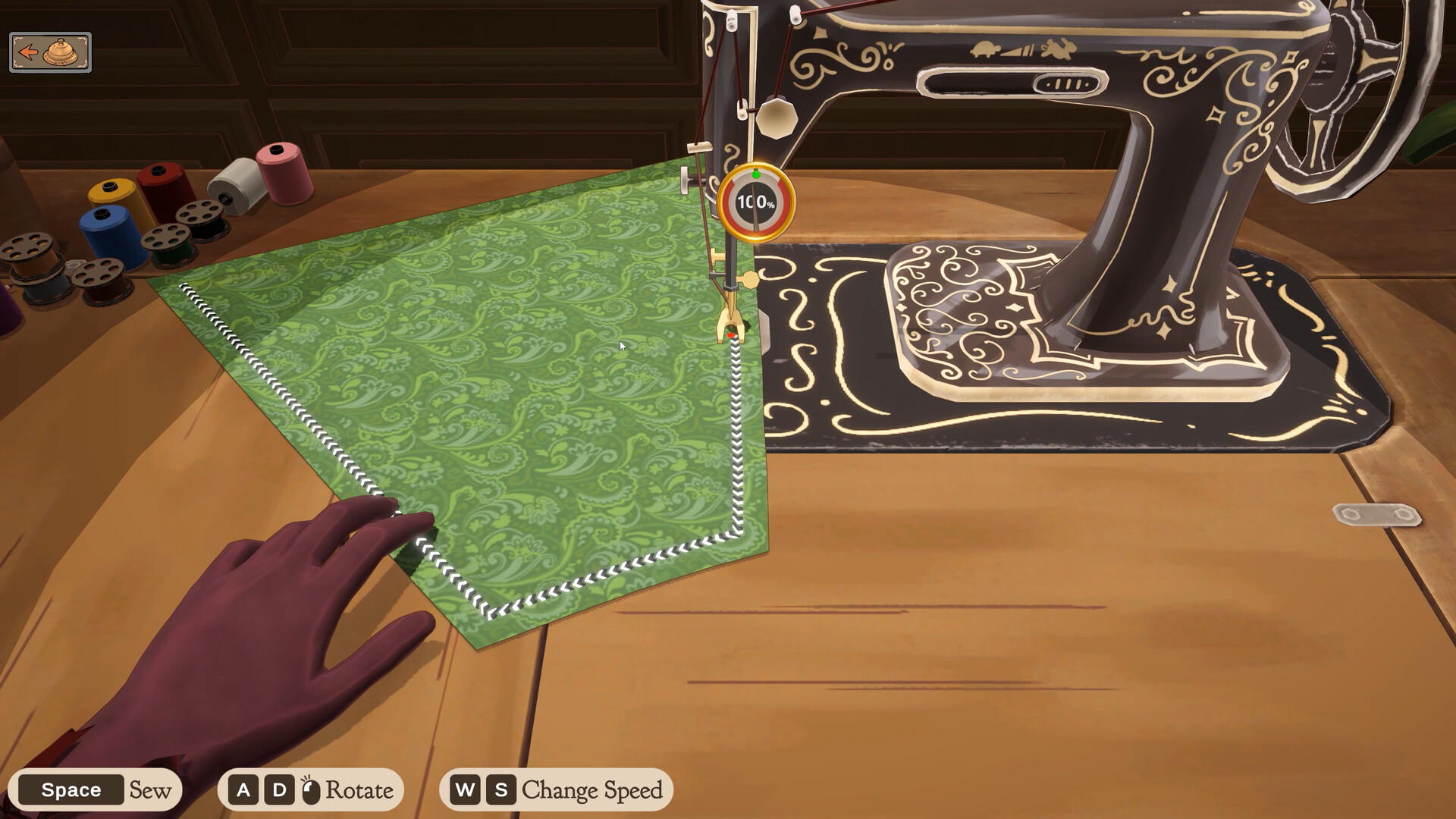 The Dressmaker sewing machine: guide the fabric through while the dial reads 100%